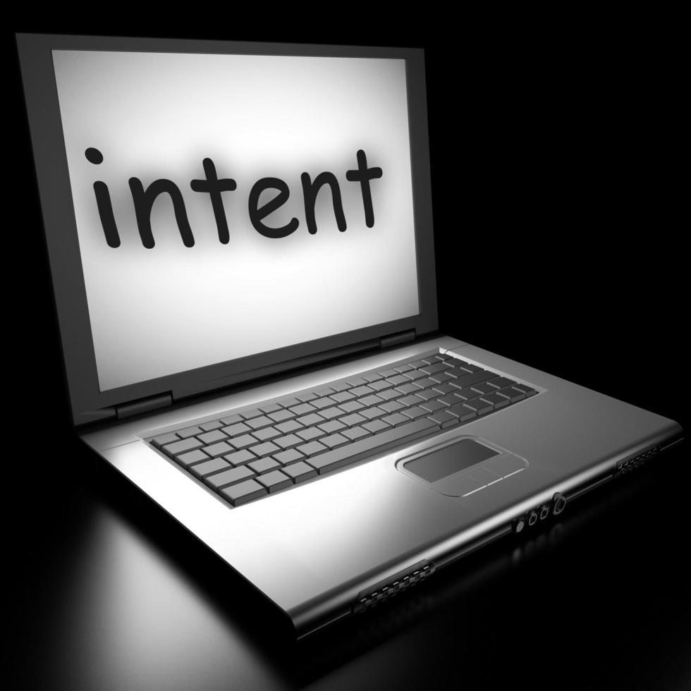 Black laptop displaying the word 'intent' on the screen, symbolizing digital focus or user intent in computing.